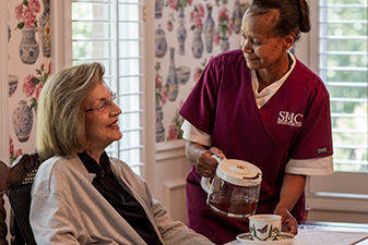 Around-the-clock, 24/7 Seniors Home Care caregiver helping a client