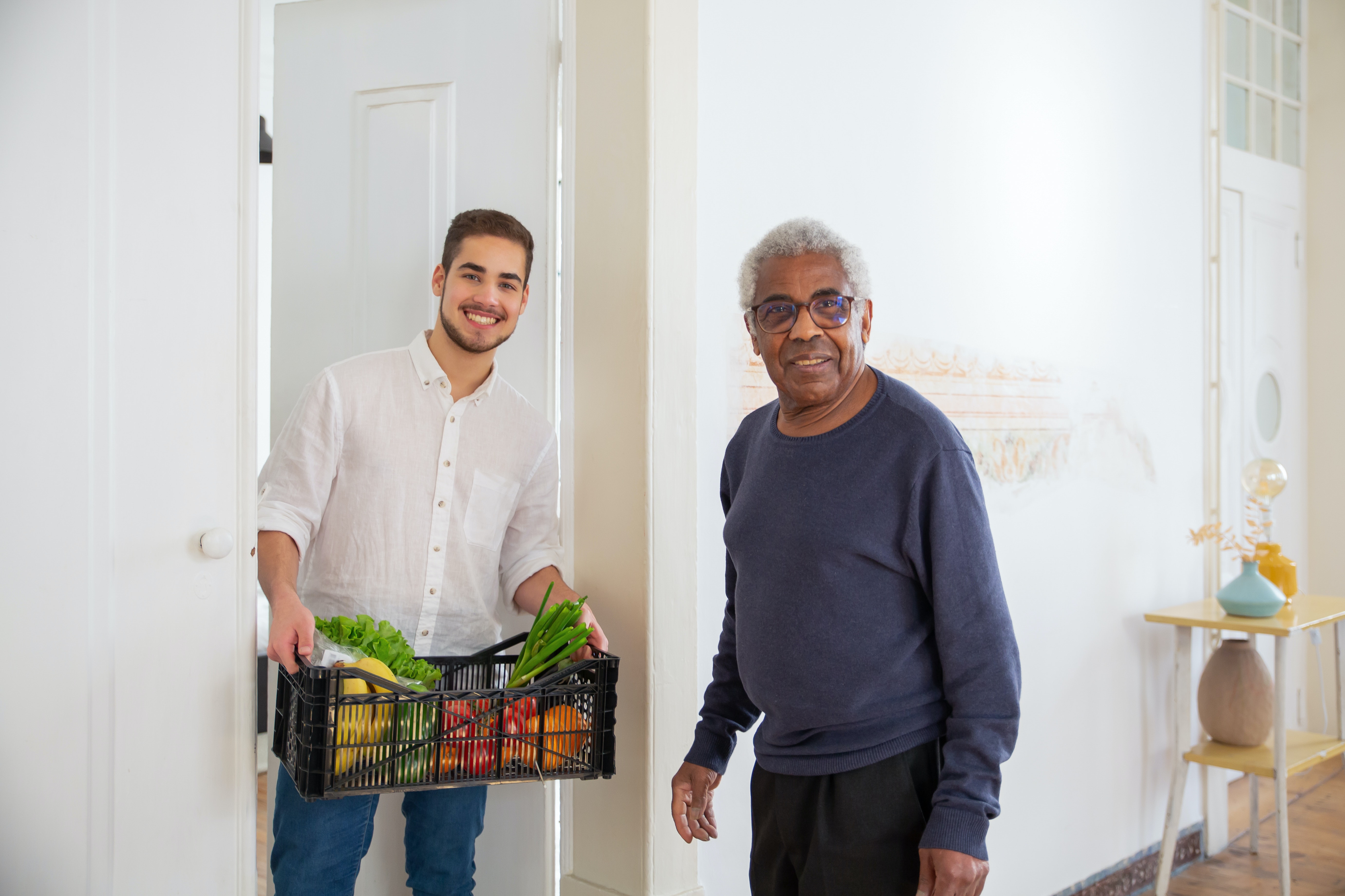 Man delivering groceries to a senior in the best in home care
