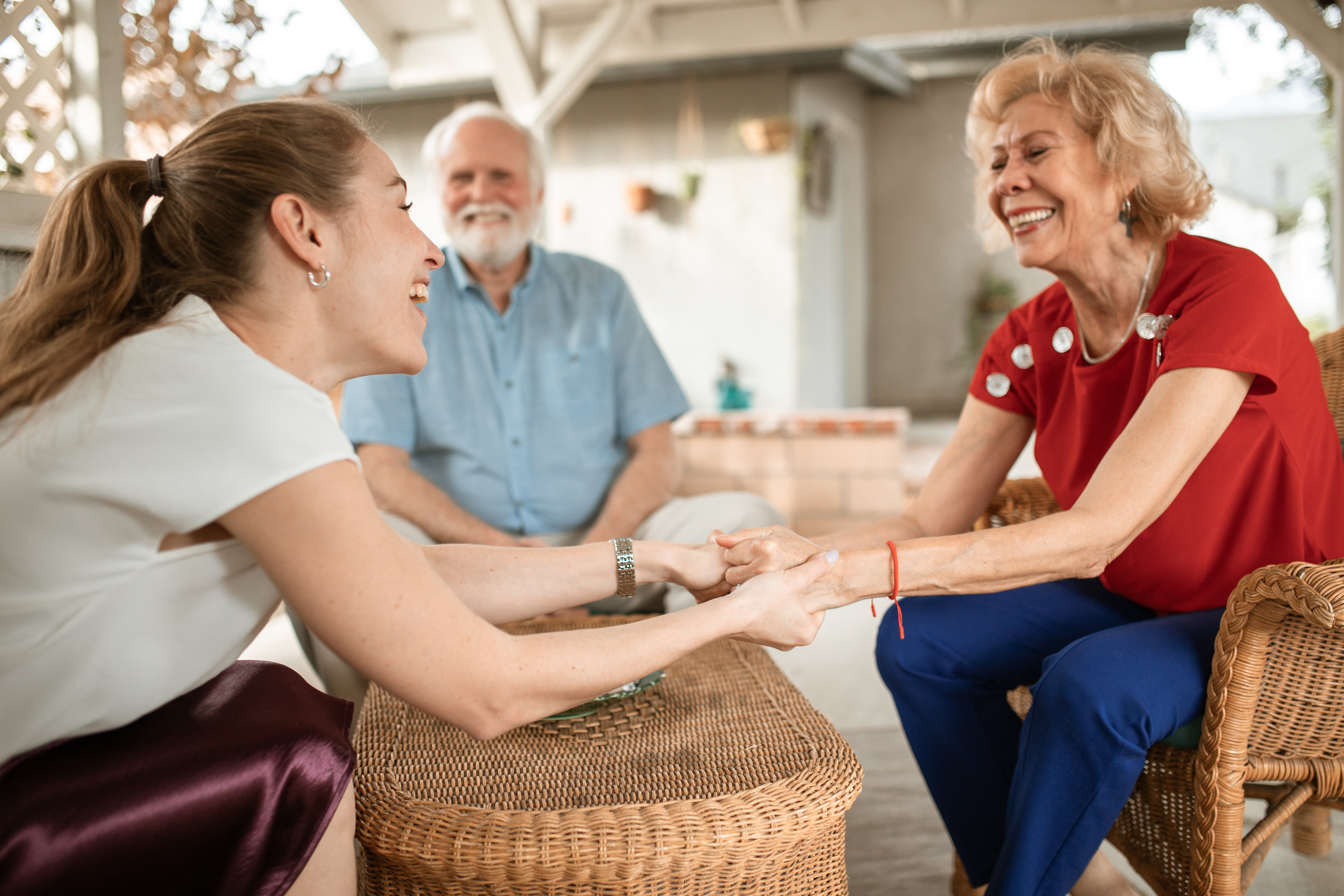 Young woman with her elderly parents asking questions to ask seniors.